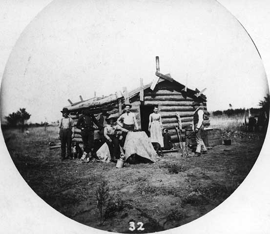 Photograph of a frontier cabin, 1880.