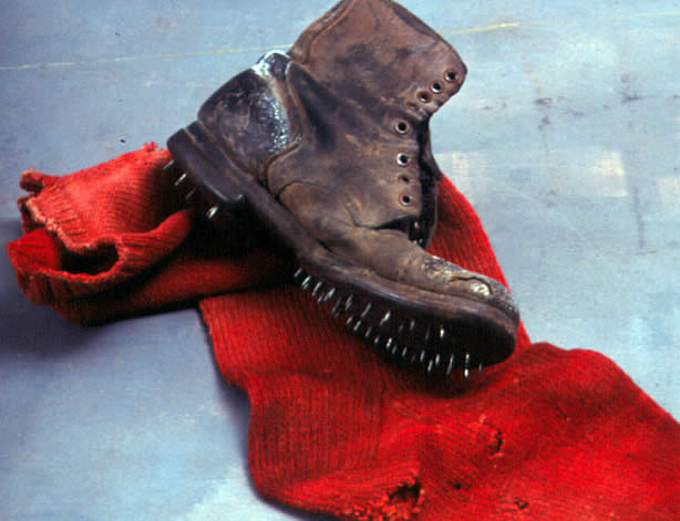Color photo of a caulk boot and a large red sock with holes in it.