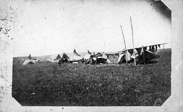 Photo of Dakota dwellings on the prairie, 1865.