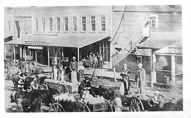 Photo of Red Wing's Main Street crowded with ox carts and pedestrians, ca. 1860.