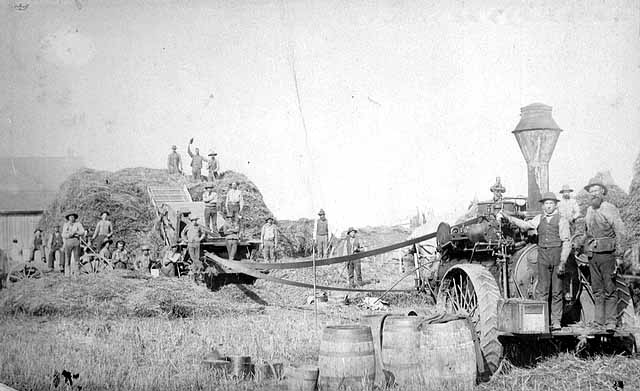 Photo of threshing crew and machinery, ca. 1880-1889.