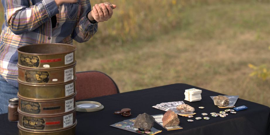 guest examines artifacts