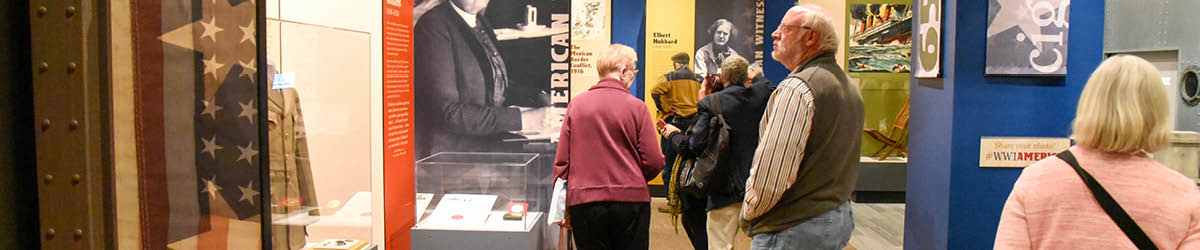 A group of adults walking through an exhibit.